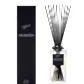 A bottle of Sohum Fragrance Diffuser by Flowers on Norton St boasts sleek black sticks with natural fiber reeds, offering a fine fragrance experience.