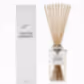 A rectangular glass Sohum Fragrance Diffuser labeled "Tahitian Gardenia" sits beside its matching white box. Long natural fiber reeds emerge from the bottle's silver cap, crafting a fine fragrance that elegantly enhances any space with its aromatic allure. This exquisite product is by Flowers on Norton St.