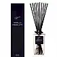 A rectangular glass bottle of the "Sohum Fragrance Diffuser," featuring natural fiber reeds, is placed next to its matching black box packaging. The label displays the brand "Flowers on Norton St" in elegant script, promising a fine fragrance experience.