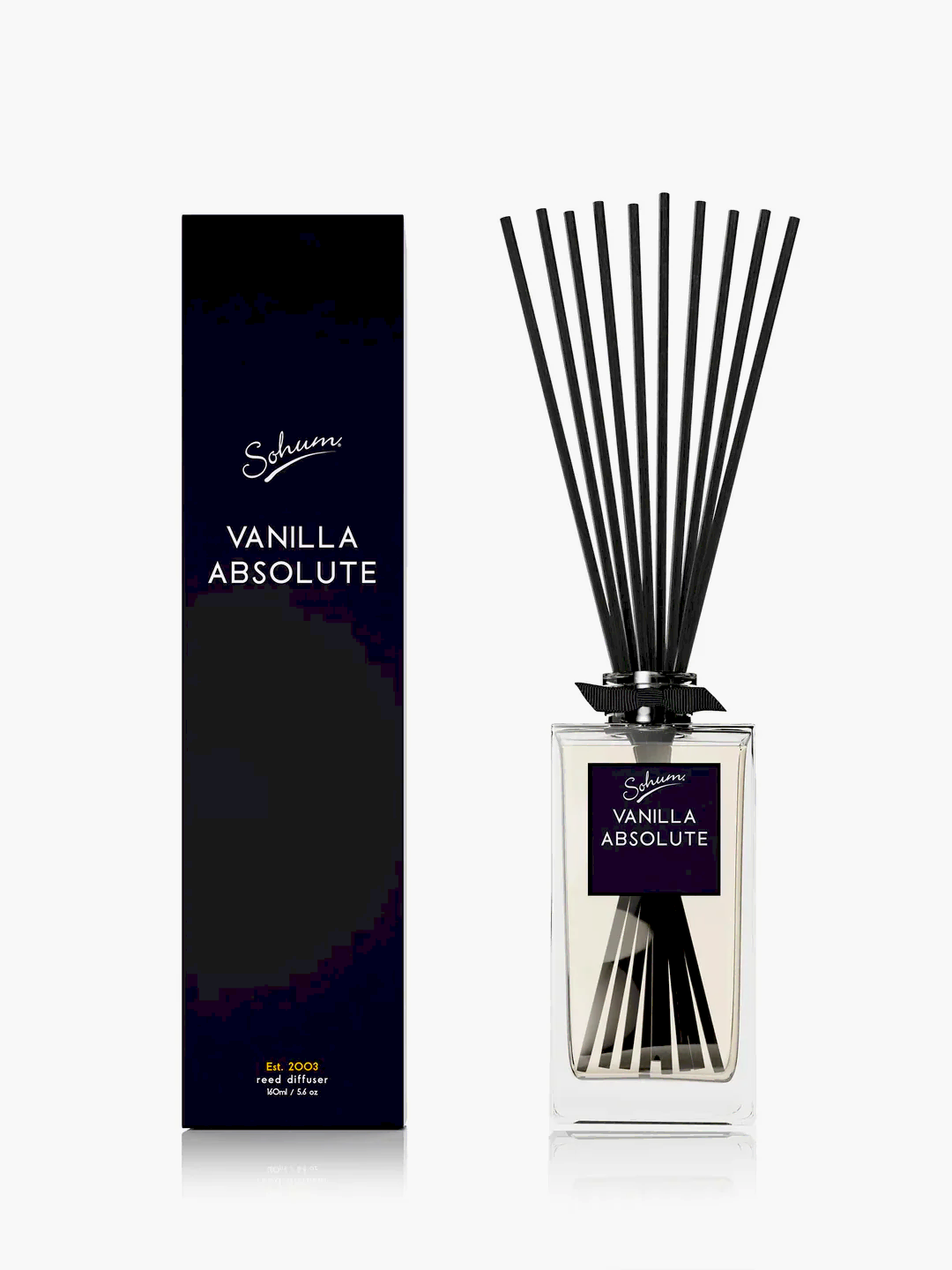 A rectangular glass bottle of the "Sohum Fragrance Diffuser," featuring natural fiber reeds, is placed next to its matching black box packaging. The label displays the brand "Flowers on Norton St" in elegant script, promising a fine fragrance experience.