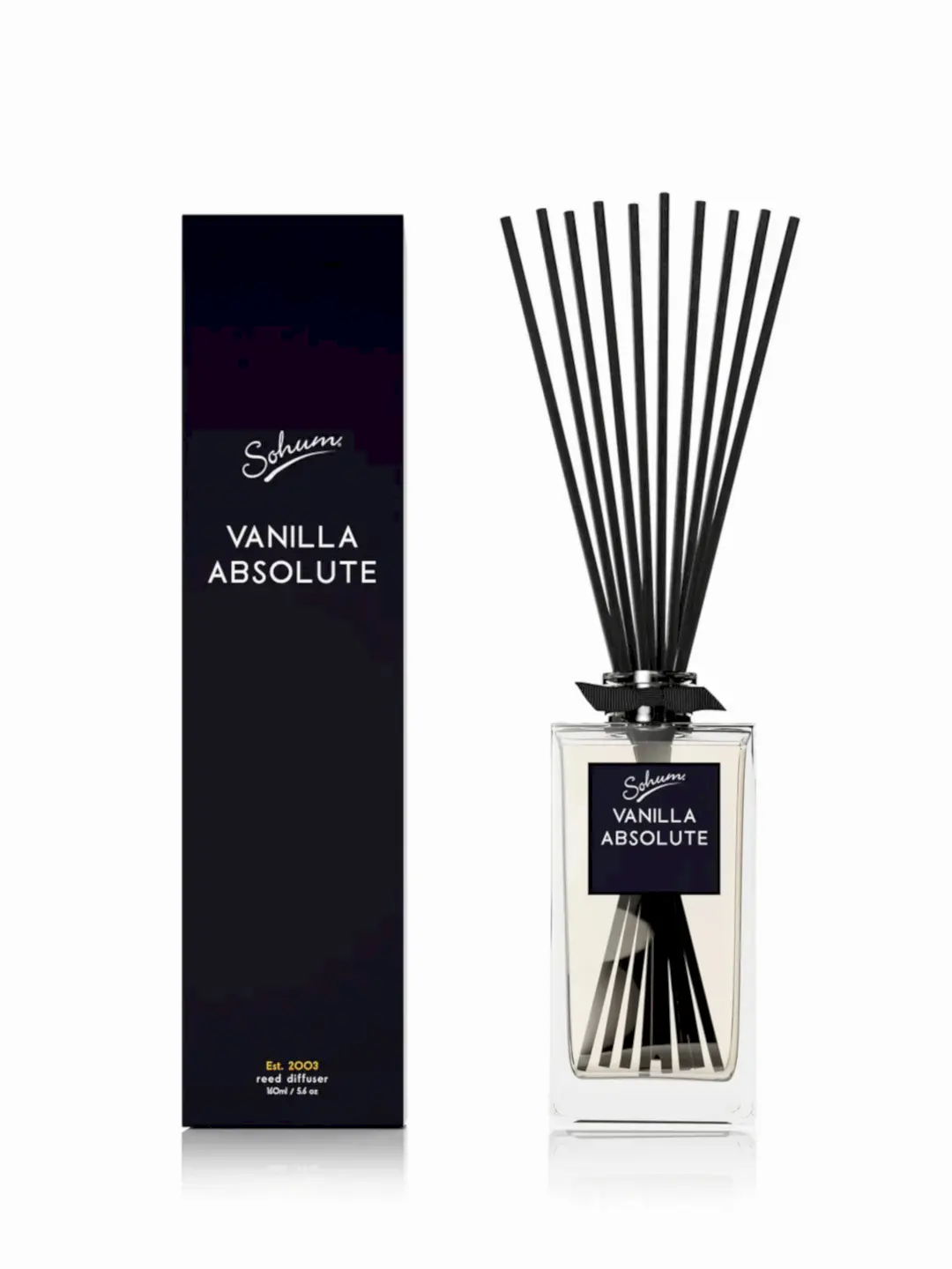 A rectangular glass bottle of the "Sohum Fragrance Diffuser," featuring natural fiber reeds, is placed next to its matching black box packaging. The label displays the brand "Flowers on Norton St" in elegant script, promising a fine fragrance experience.