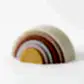 The Silicone Rainbow Stacker Toy by Flowers on Norton St includes seven arches in muted colors such as beige, pink, and gray. Crafted from non-toxic silicone, these arches are arranged by size on a white background.