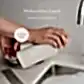 A person holds a bottle of AL.IVE BODY dishwashing liquid by Flowers on Norton St, an essential for the kitchen with a refreshing lemon and pomegranate scent, near the sink. A circular label reads "In Store Now," set against a backdrop of light-colored tiled walls.
