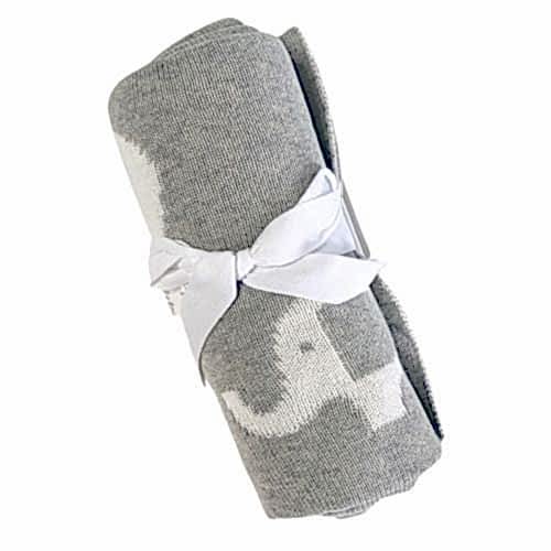 The Ellie Baby Blanket from FlowersonNortonSt is a cozy gray blanket adorned with white elephant patterns and comes elegantly tied with a white ribbon.