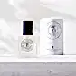 A sleek clear glass bottle of "The Perfume Oil Roll-On" by Flowers on Norton St, adorned with a black cap, stands gracefully beside a matching cylindrical box. Both are elegantly branded with the Flowers on Norton St logo and feature the text "Melbourne Australia" alongside "10ml - 1/3 oz." This compact design is ideal for roll-on perfume oils, set against a crisp white background.