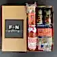 A beautifully curated Pasta for Two Gift Box from Flowers on Norton St includes a jar of red pasta sauce, a package of Spaghetti and Tortiglioni on the right, and three cans of craft beer on the left. The lid is elegantly printed with "F + N gifting," making it an ideal present for culinary enthusiasts.