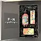 A black gift box featuring the "Flowers on Norton St" branding adorns the lid. Inside, it holds a Jasmine Peach hand wash bottle and two floral-patterned soap bars from the Royal Botanical Gardens Fragrance Collection, all cushioned in shredded black paper.