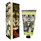 A tube and box of KEW Hand Cream by Flowers on Norton St from the floral collection. The packaging, inspired by Kew Royal Botanical Gardens, features intricate black and white illustrations of moths and leaves, accented with red berries and green text.