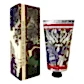 A tube of KEW Hand Cream from the Flowers on Norton St collection is embellished with intricate botanical illustrations, featuring detailed vintage-style drawings of figs, grapes, and leaves that seamlessly complement its sophisticated box.