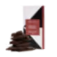 A FlowersonNortonSt Koko Black Chocolate Block stands upright. Next to it, a stack of dark chocolate pieces is arranged. The maroon and white packaging reveals a handcrafted delight, combining freshly ground aromatic coffee with 54% dark chocolate made from sustainably sourced cocoa.