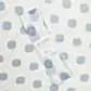 A rolled Muslin Wrap by FlowersonNortonSt, featuring blue polka dots on a matching background, is perfect for wrapping a baby.